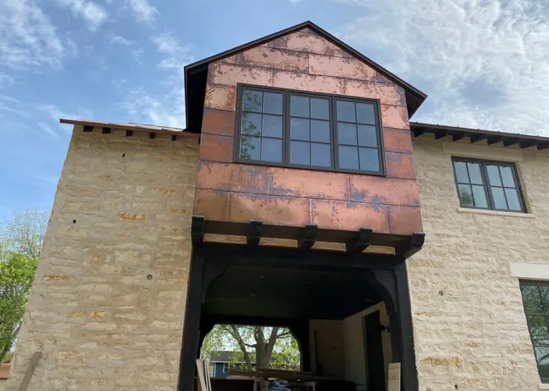 Copper metal panel facade on a stone building for Skylight Installation in Los Gatos